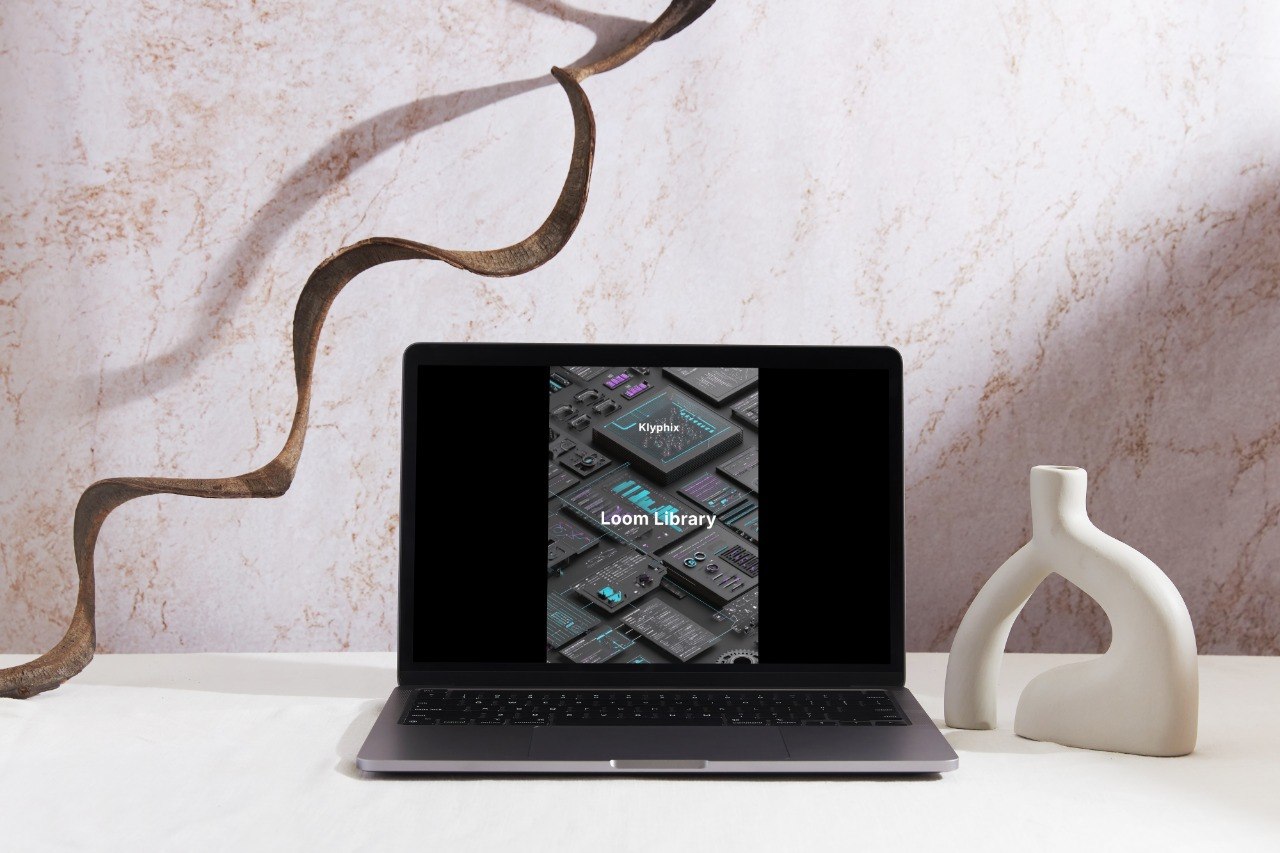 Laptop displaying a software interface on a decorative surface with a marble wall background